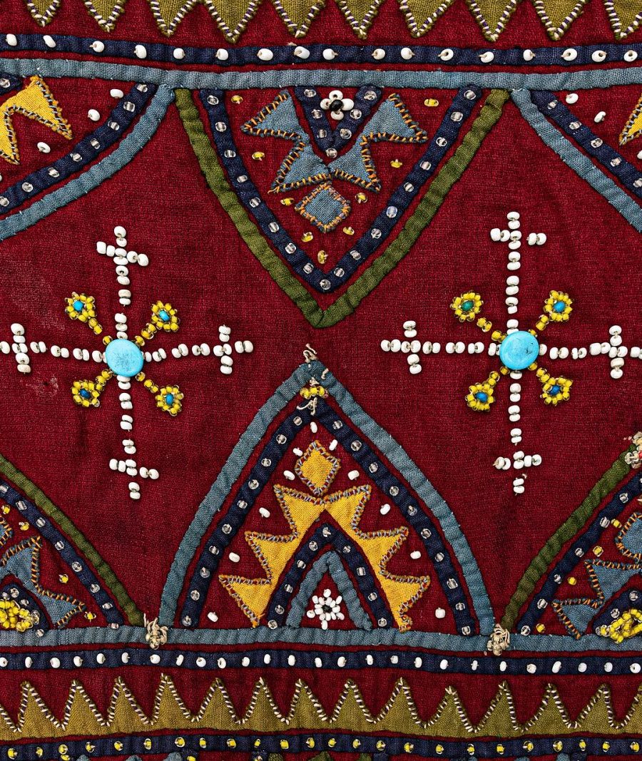 Embroidered suzani panel with radiating medallions in crimson and ochre