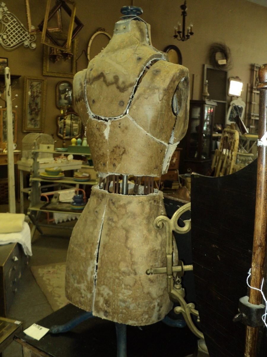 Antique linen dress form on a cast-iron stand