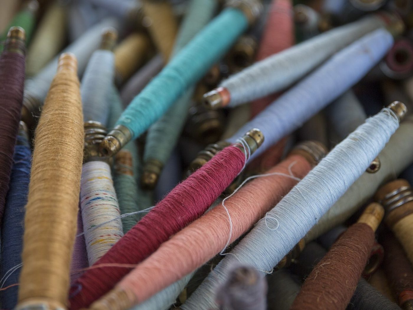 Wound silk bobbins in graded colours, close detail