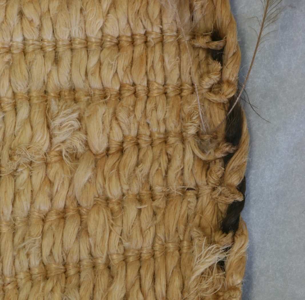 Coarse natural fibre weave in raking light, macro detail